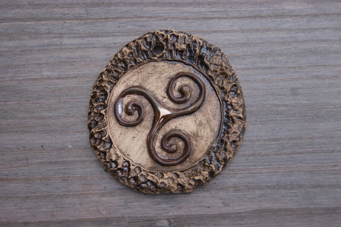 Ceramic medallion with triskelion symbol ceramic pendant