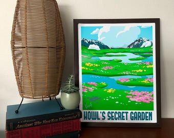 May include: A framed print of a whimsical landscape with a blue sky, white clouds, green hills, a winding blue river, and pink and yellow flowers. The print is titled "Howl's Secret Garden".