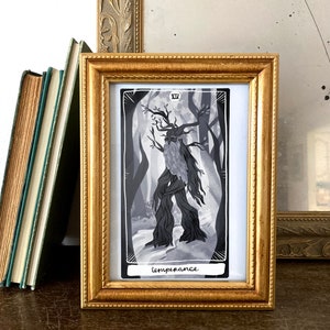 May include: A framed tarot card with a black and white illustration of a tree-like figure with a beard and branches. The card is titled "Temperance" and has the Roman numeral XIV in the top right corner.