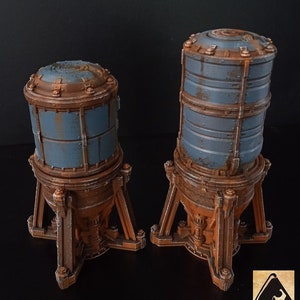 May include: Two rusty metal tanks with blue panels and a tripod base. The tanks are different sizes and are on a dark background.