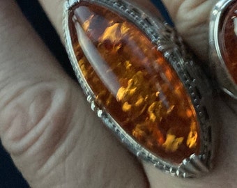 hallmarked 925 silver ring with genuine Royal amber hand carved stone
