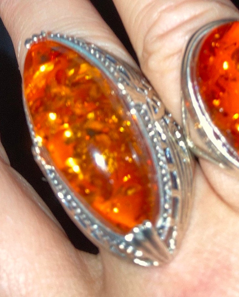 hallmarked 925 silver ring with genuine Royal amber hand carved stone