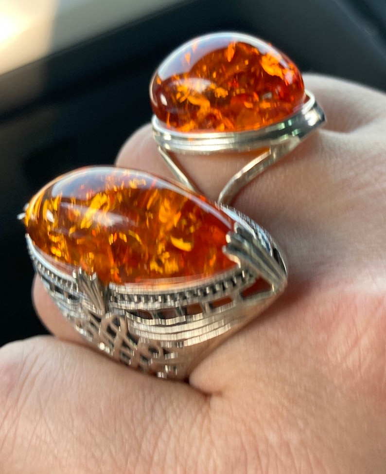 hallmarked 925 silver ring with genuine Royal amber hand carved stone