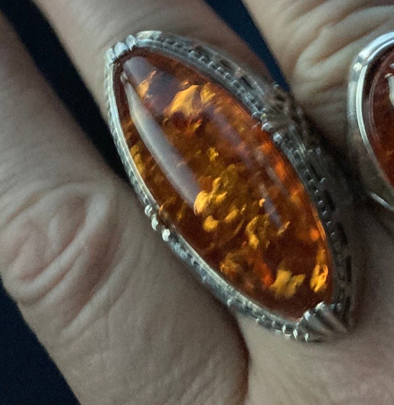 hallmarked 925 silver ring with genuine Royal amber hand carved stone