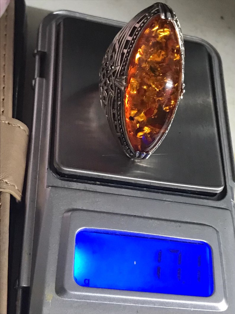 hallmarked 925 silver ring with genuine Royal amber hand carved stone