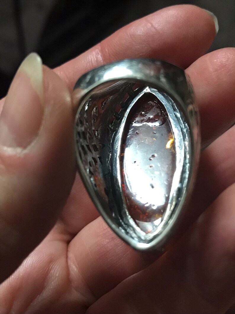 hallmarked 925 silver ring with genuine Royal amber hand carved stone