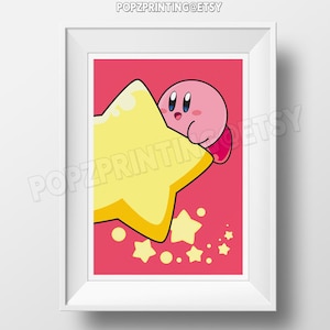 May include: A framed print featuring a pink cartoon character peeking over a large yellow star. The character has blue eyes and red feet. The background is a solid pink color, with smaller yellow stars scattered around. The text "POZPRINTING@ETSY" is at the top.
