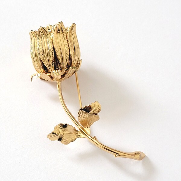 Flower bud brooch, vintage Monet floral pin, gold plated, with long stem, classic lapel pin