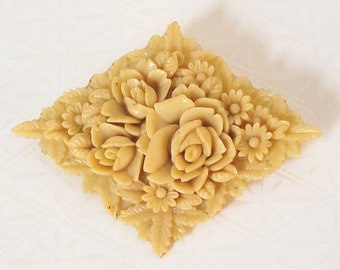 Celluloid or early plastic flower brooch, with roses and leaves in neutral beige cream color, from Japan