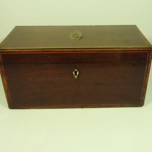 A mahogany georgian tea caddy