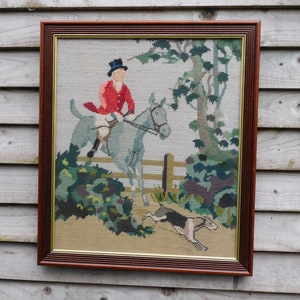 A Huntsman tapestry in a frame