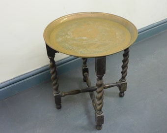 vintage/antique oriental round brass engraved top tea/coffee table with folding wooden Barley Twist base/stand,