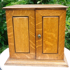 Edwardian oak table smokers cabinet