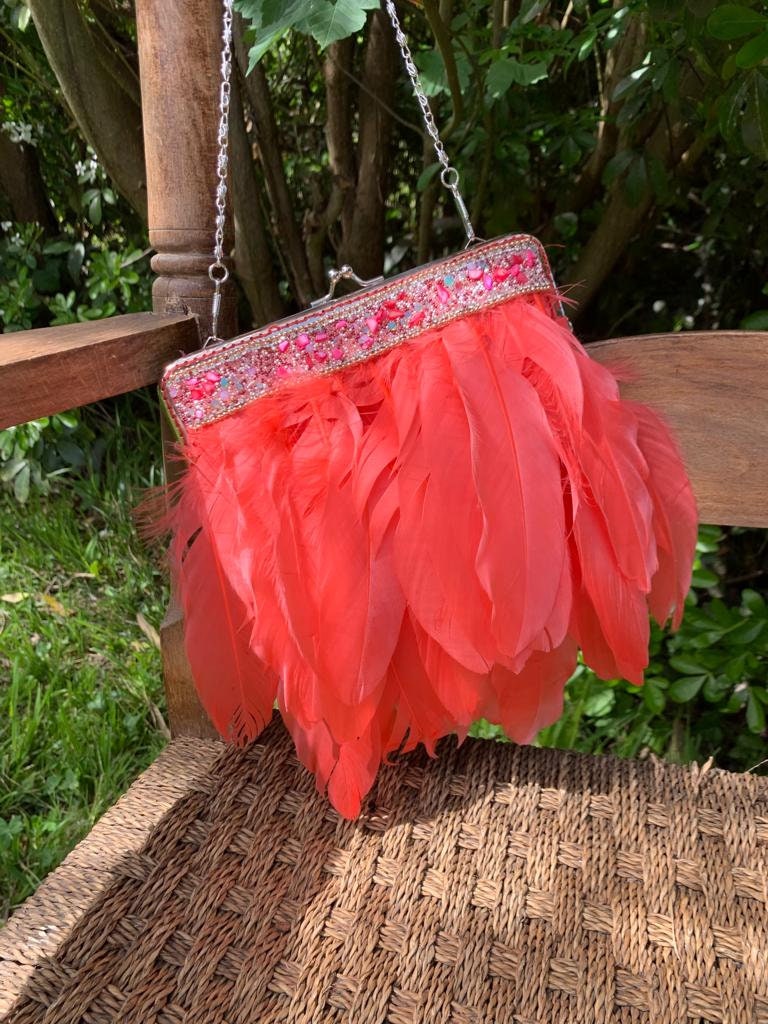 Pink feather hotsell clutch bag