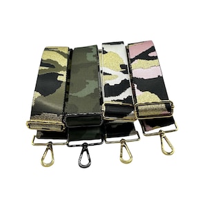 May include: Four different camouflage patterned adjustable straps with gold hardware. The straps are made of a woven fabric with a subtle sheen.