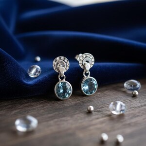 Sterling Silver Earpost Earrings with Natural Oval Faceted Blue Topaz