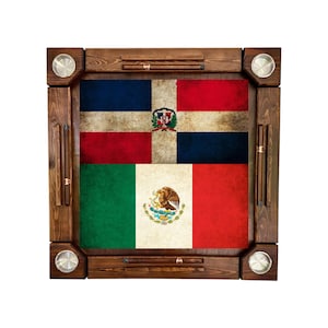 May include: A wooden dominoes table featuring the flags of the Dominican Republic and Mexico. The table has a dark brown frame with metal cup holders and storage for dominoes. The flags are displayed in a distressed, vintage style.