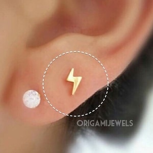 Pendiente de cartílago con forma de rayo • Pequeños pernos para trago sin rosca • Perno de 18 g con forma de caracol en el labio • Delicado piercing para cartílago con pequeño perno dorado
