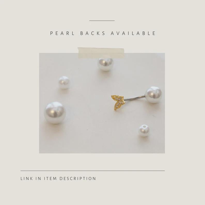 May include: A gold-colored, arrow-shaped earring with a pearl back, and several white pearl earrings. The text "PEARL BACKS AVAILABLE" is at the top of the image. The text "LINK IN ITEM DESCRIPTION" is at the bottom of the image.