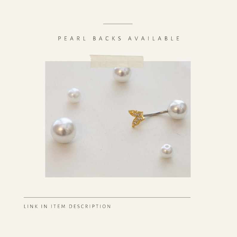 May include: A belly button ring with a gold-colored, leaf-shaped charm and a large white pearl. The image also shows several loose white pearls of varying sizes. Text reads "PEARL BACKS AVAILABLE" and "LINK IN ITEM DESCRIPTION."