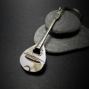 Handmade keychain with musical instruments,bouzouki,acoustic guitar,electric guitar,violin and Crete&#39;s Greek lyra.&quot;Music is life&quot;