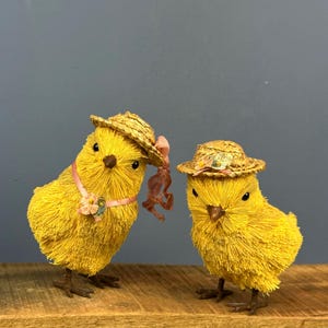 May include: A set of three ceramic mugs with a speckled, matte finish. The mugs are in shades of cream, light gray, and dark gray. Each mug has a simple, minimalist design, perfect for coffee or tea.