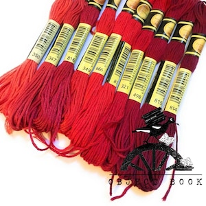 May include: A set of ten red embroidery floss spools with yellow labels and black numbers. The numbers on the spools are 350, 347, 816, 349, 666, 81, 321, 498, 815, and 814.