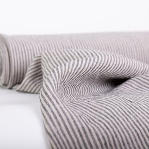Medium weight, washed, dense, and durable flax fabric in a striped pattern. Linen fabric sold by the yard for sewing or crafting projects