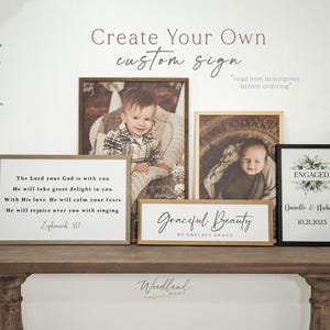 May include: A collection of framed signs and photos on a wooden table. The signs include text that reads "Create Your Own custom sign", "The Lord your God is with you", "Graceful Beauty", and "ENGAGED".