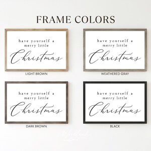 May include: Four framed Christmas signs with the text "have yourself a merry little Christmas." Frames are light brown, weathered grey, dark brown, and black. The text is in a cursive font on a white background.