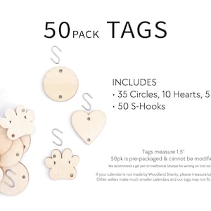 May include: A collection of 50 wooden tags, including 35 circles, 10 hearts, and 5 paw-shaped tags, with 50 S-hooks. The tags measure 1.5 inches. The word "TAGS" is displayed in large, bold text.