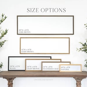 May include: A display of rectangular framed signs in various sizes and colors, including dark brown, light brown, black, weathered gray, and natural. The signs are labeled with size options, such as 48"W x 16"H, and the text "SIZE OPTIONS" is at the top.