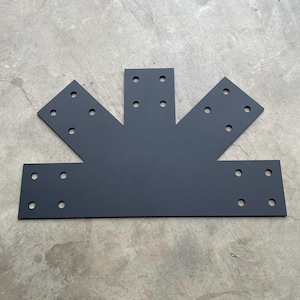 May include: Black metal bracket with multiple holes for attaching to a structure. The bracket is shaped like a three-pointed star.