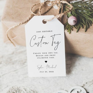 May include: A white gift tag with black text that reads "100% Editable Custom Tag". The tag also includes the text "Create your own tag. Design and print unlimited tags." and "Sophia - Michael July 23, 2022".
