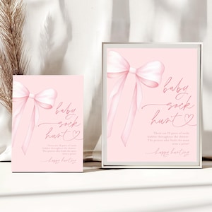 May include: Pink printable sign with a pink bow and the text "baby sock hunt" with instructions for a baby shower game. The text says "There are 10 pairs of socks hidden throughout the shower. The person who finds the most wins a prize!"