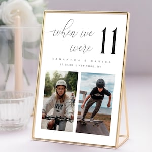 May include: A gold metal framed photo display with the text "when we were 11". The display includes two photos of children, and the names "Samantha & Daniel" with a date and location. The display is on a white surface.
