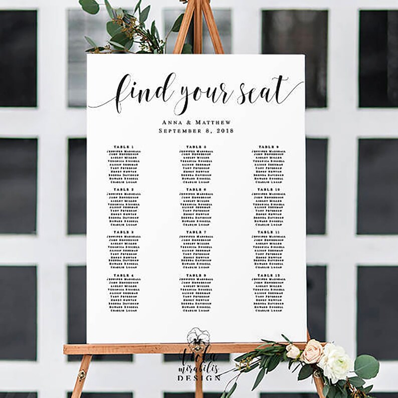 May include: A white wedding seating chart with black text. The chart is titled "Find Your Seat" with the names Anna & Matthew and the date September 8, 2018. The chart lists tables with guest names.