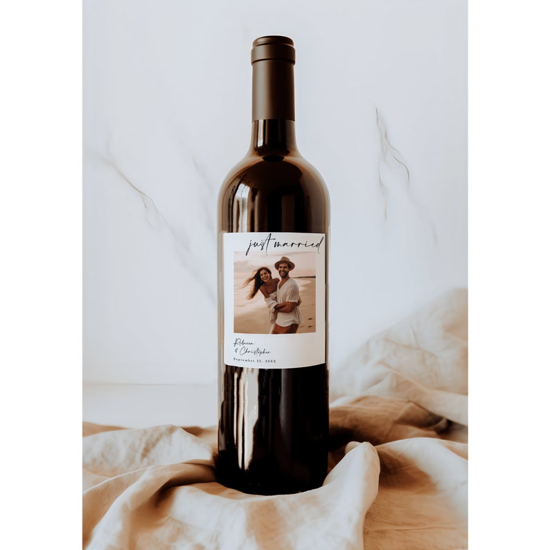 May include: A wine bottle with a personalized label that says "just married" with a photo of a couple and the text "Rebecca & Christopher September 21, 2023".