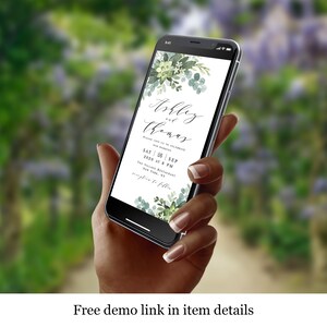 May include: A smartphone displaying a wedding invitation with a green floral design. The invitation reads "Ashley and Thomas" with the date and time of the wedding. The text "Please join us to celebrate our wedding" is also included.
