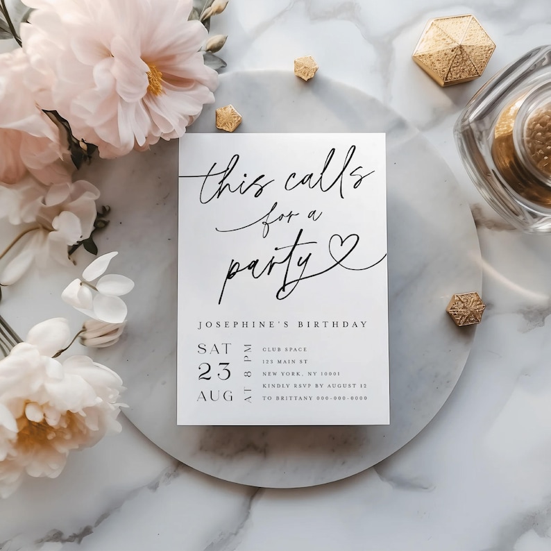 Elegant printed party invitation card styled with pastel pink flowers and golden accents, displayed on a marble background. The invitation features modern calligraphy text with customizable details for birthdays or anniversaries. Professionally printed and shipped with envelopes, this design highlights sophistication and makes a stunning keepsake for guests.