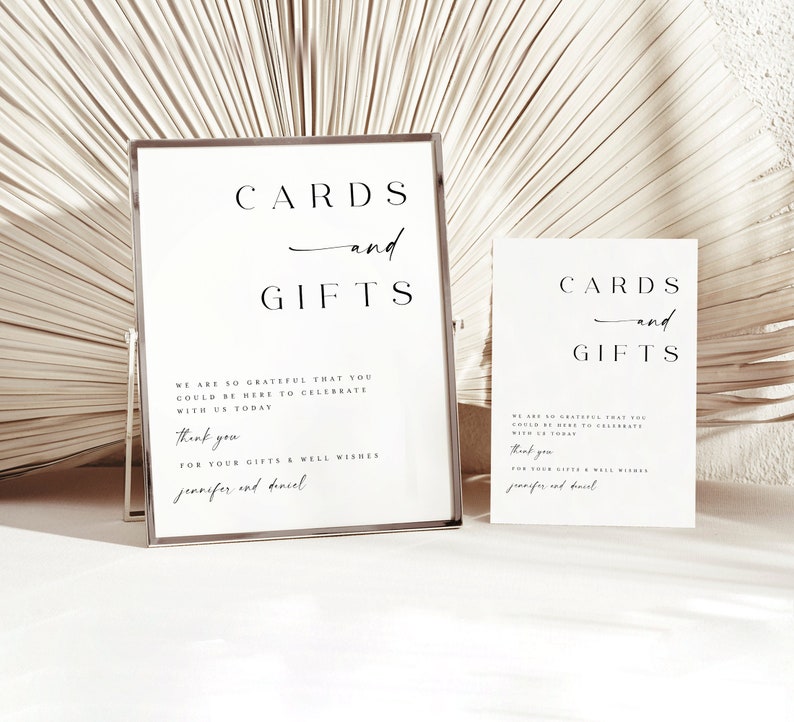 May include: Two white signs with black text that read "CARDS and GIFTS". The signs are on a stand and have a message thanking guests for their gifts and well wishes.