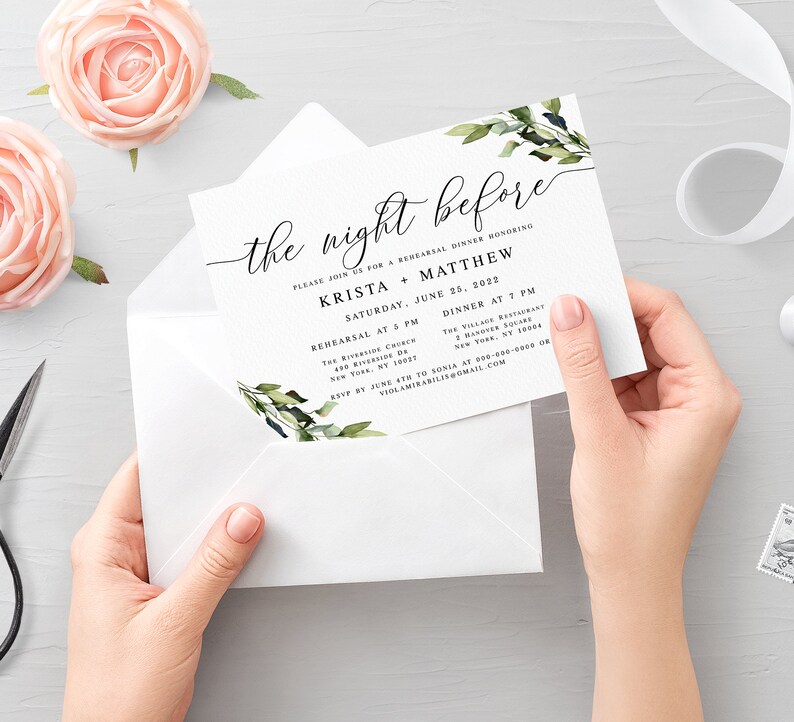 May include: A white invitation card with green foliage and the text "the night before" in black calligraphy. The invitation is for a rehearsal dinner honoring Krista + Matthew on Saturday, June 25, 2022. The invitation includes the time and location for the rehearsal and dinner.