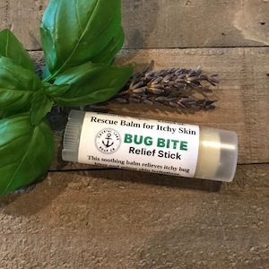 May include: A white tube of bug bite relief stick with a blue and white label that says "Rescue Balm for Itchy Skin" and "Bug Bite Relief Stick". The label also features a small anchor logo.