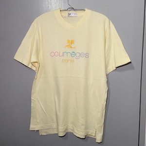 May include: A yellow short-sleeved t-shirt with a multi-coloured embroidered logo that says "Courr&egrave;ges Paris".