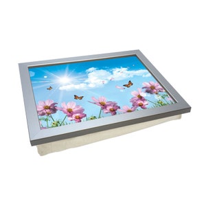 May include: A silver tray with a cushioned base features a printed image of pink flowers and butterflies against a blue sky background.