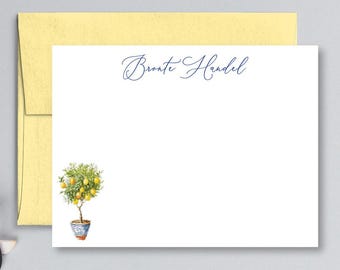 May include: A white stationery card with a blue cursive font that reads "Bronte Handel". A small illustration of a potted lemon tree with yellow lemons is in the bottom left corner.