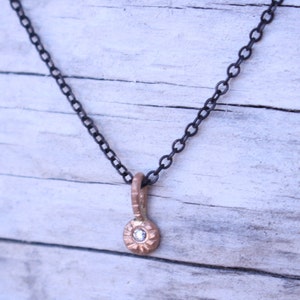 Mixed metal charm necklace 14 k gold diamond