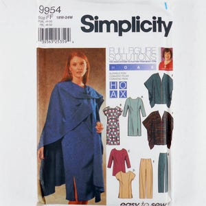 May include: A Simplicity sewing pattern envelope 9954 for sizes 18W-24W, featuring Full Figure Solutions. The cover displays a blue wrap-style garment and illustrations of various clothing options including dresses, tops, and pants with the text easy to sew.