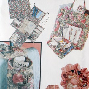 May include: A set of five floral fabric bags with various pockets and compartments. The bags are filled with sewing supplies, including scissors, thread, and fabric scraps. The bags are perfect for organizing and storing sewing supplies.