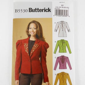 May include: A Butterick sewing pattern packet, B5530, featuring a woman wearing a red blazer with gold embellishments. The packet includes illustrations of different blazer styles. The size range is 14-16-18-20-22.